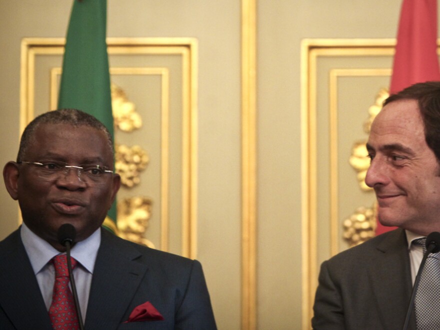 Portugal's minister of foreign affairs, Paulo Portas (right), meets with his Angolan counterpart, Georges Chikoti, during a press conference in Lisbon, Portugal, in 2010. A growing number of Portuguese workers are seeking employment in their country's former, resources-rich African colony.