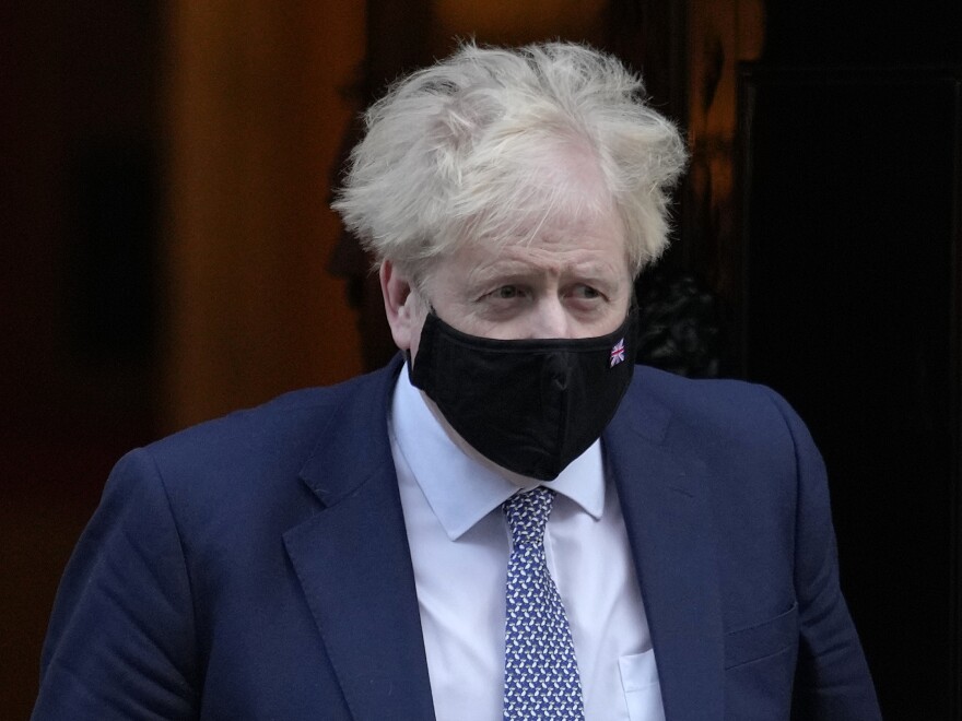 Britain's Prime Minister Boris Johnson leaves Downing Street to attend the weekly session of Prime Ministers Questions in London, Wednesday, Jan. 12, 2022. British Prime Minister Boris Johnson is facing a wave of public and political outrage over allegations that he and his staff flouted coronavirus lockdown rules by holding a garden party in 2020 while Britons were barred by law from meeting up with more than one person outside their households.(AP Photo/Kirsty Wigglesworth)