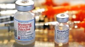 FILE - This Thursday, Feb. 25, 2021 file photo shows vials for the Moderna and Pfizer COVID-19 vaccines at a temporary clinic in Exeter, N.H.