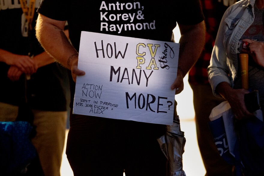 Dozens of community members gather on Monday, Oct. 24, 2022, during a vigil for Central Visual and Performing Arts High School at Tower Grove Park. A gunman attacked the school in south St. Louis on Monday morning, killing two and injuring seven.