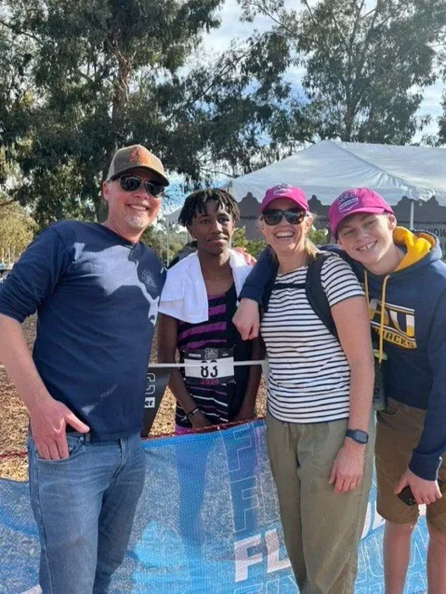 Yohanes van Meerten pictured with his parents, Brian van Meerten (left) and Sara Clancey (second from right) and his brother, Liam (right).