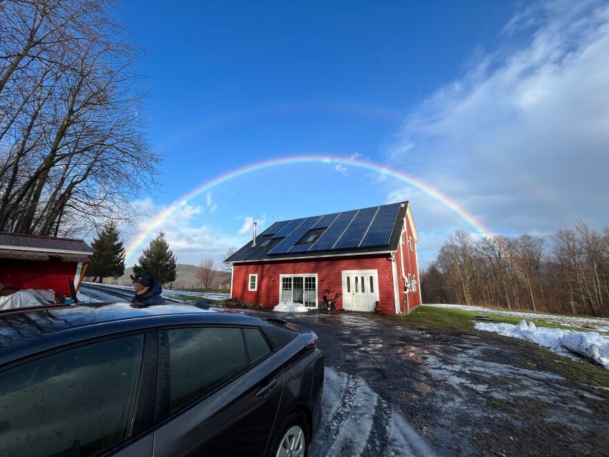 A rainbow over a barn