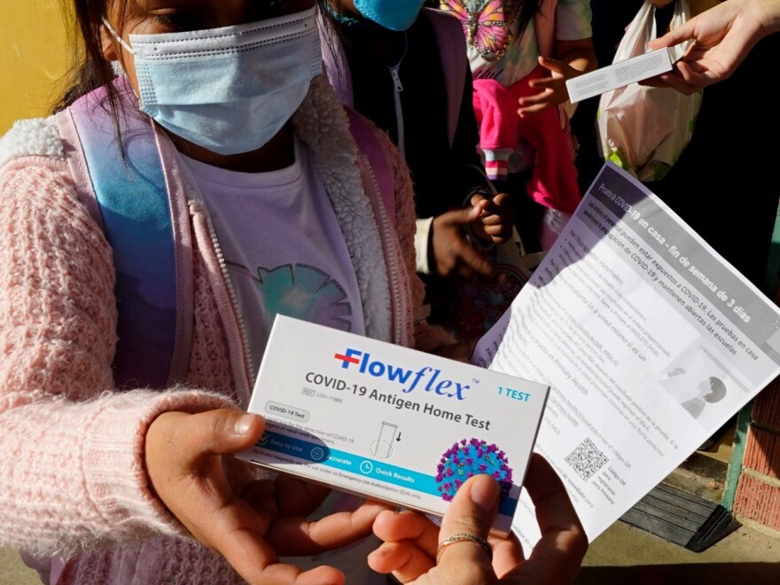 A second grade student is given an at-home COVID-19 test at H.W. Harkness Elementary School in Sacramento, Calif., on Feb. 11, 2022.