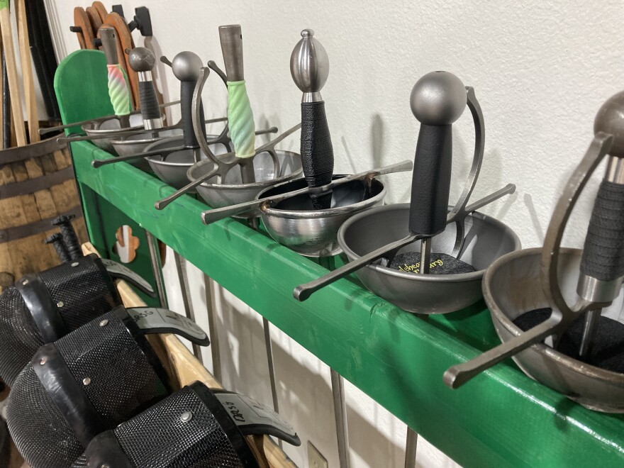 The swords used by the Dallas Renaissance Sword Guild typically weigh between 2 1/2 - 3 pounds.