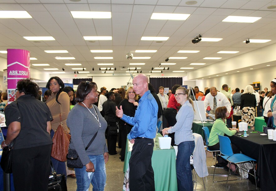 Job seekers attend a job held on Sept. 13