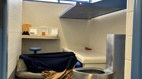 An unidentified woman lies under a blanket in a cell in the Flathead County Detention Center in Kalispell, Montana. She has been held there for nearly a year after being found mentally unfit to stand trial on burglary charges, according to a jail official.