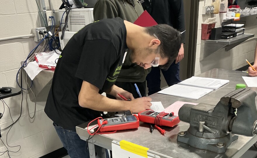 An Ypsilanti Community High School student works on an electrical engineering project.