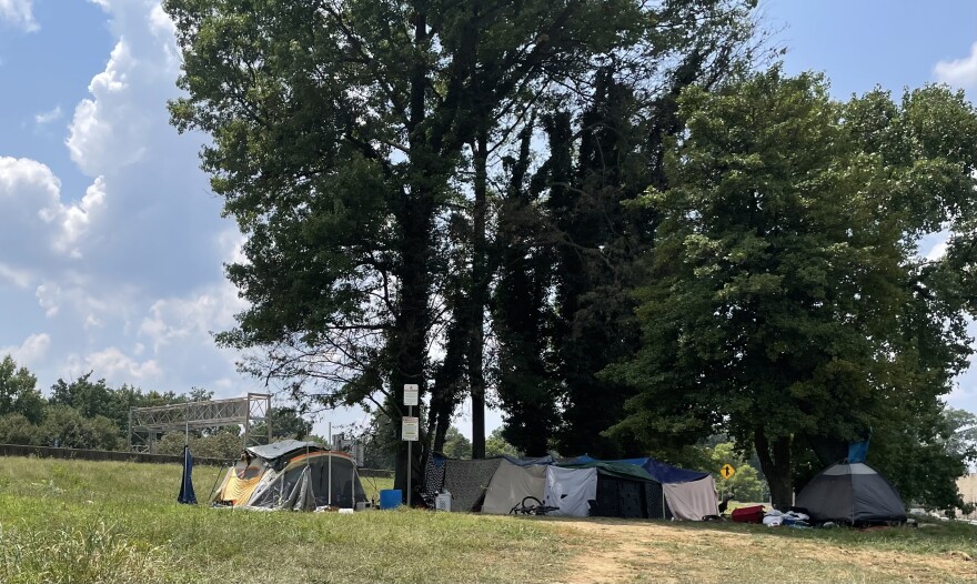 The city will demolish a homeless encampment near the interstate, citing safety risks.