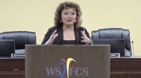 Walkertown Middle School Principal Monica Comer speaks at a podium