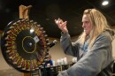 Raffle caller Heidi Heller spins the prize wheel during a meat raffle at the Hi-Stakes Cafe and Bar in Spring Lake Park, Minn., on Friday, March 27, 2026.