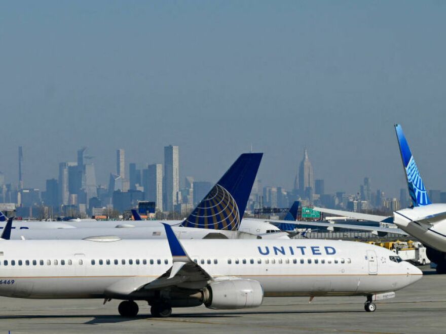 United Air Lines planes line up along the busy Newark Liberty International Airport, New Jersey, on the eve of Thanksgiving on November 23, 2022.