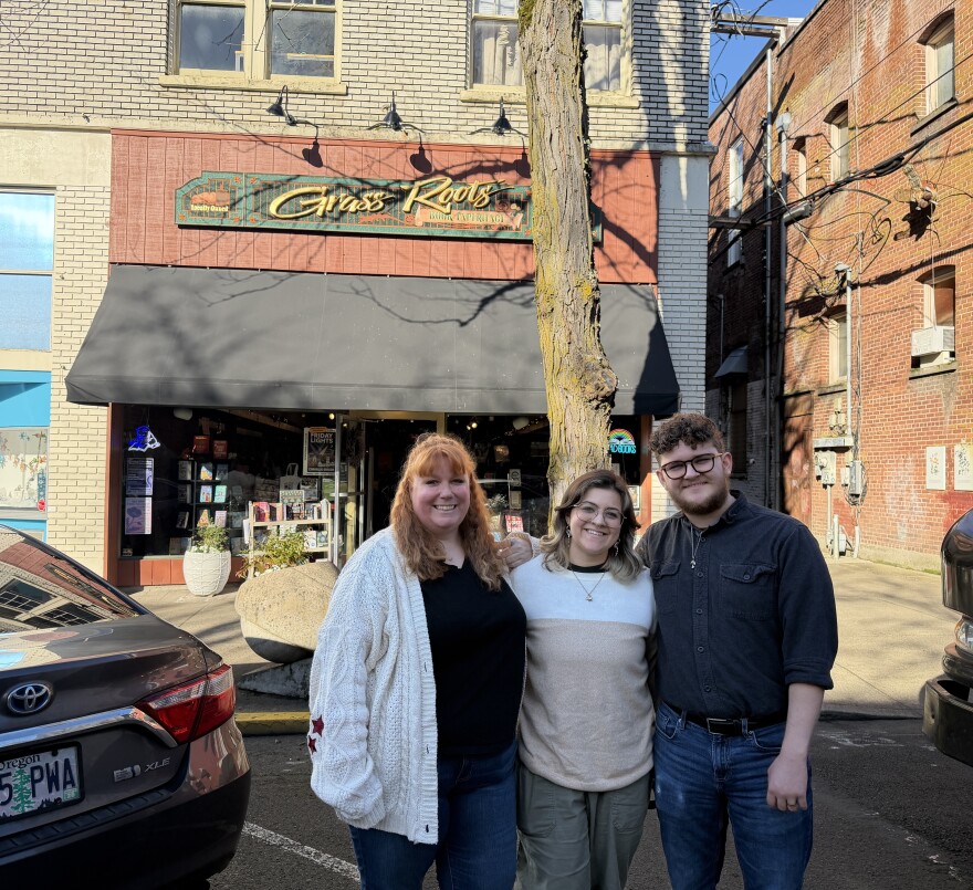 Amber Hamilton, Jay Enghauser and Brandon Enghauser stand outside of Grass Roots Books and Music in Corvallis on Feb. 25, 2026.