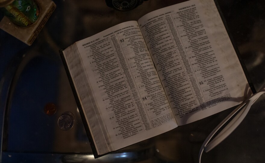 A Bible rests on the bedside table in Edilberto Espinoza Sierra's room at his family's home in Wallace on April 17, 2026. Espinoza Sierra was shot and killed by the Wilmington Police Department in the early morning hours of March 8 following an incident in a downtown Wilmington parking garage. Espinoza Sierra was incorrectly identified as a suspect before he was killed and now his family is seeking answer and accountability.