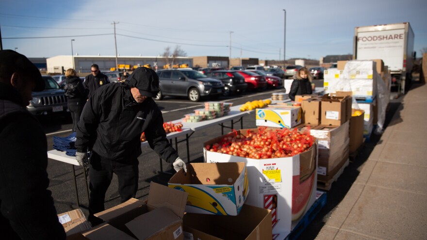 Volunteers from Foodshare, a regional food bank, set up various food items for TSA employees to pick up during an afternoon "pop-up pantry" event.