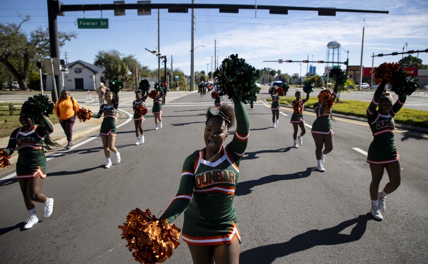 Tayayah Harris leads the Dunbar High School cheerleaders in the Dr. Martin Luther King Jr. Annual Commemorative March on Monday, Jan 19, 2026, in Fort Myers.