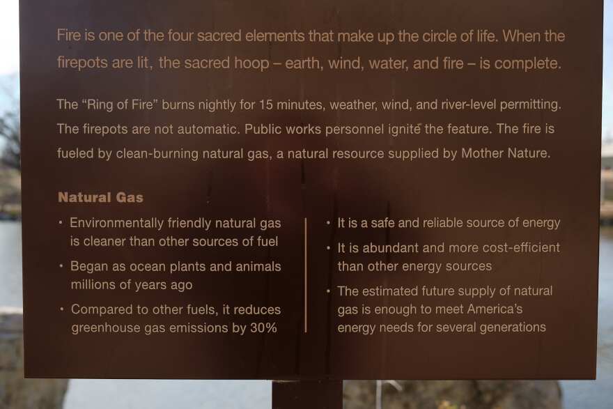 A sign promoting the value of natural gas at the Keeper of the Plains monument in Wichita donated by Kansas Gas Service.