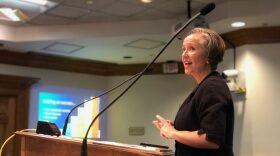 Gainesville city employee Jacqueline Stetson presents the launch of the rebranded city app myGNV to the city commissioners and the public on Thursday at Gainesville City Hall. (Nicole Needles/WUFT News)