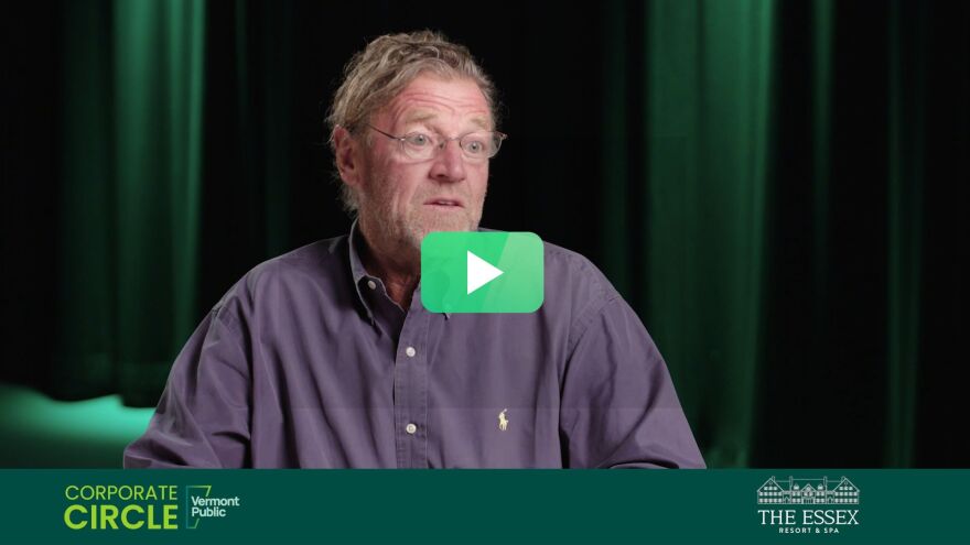 Man being interviewed / The Essex logo / green play button