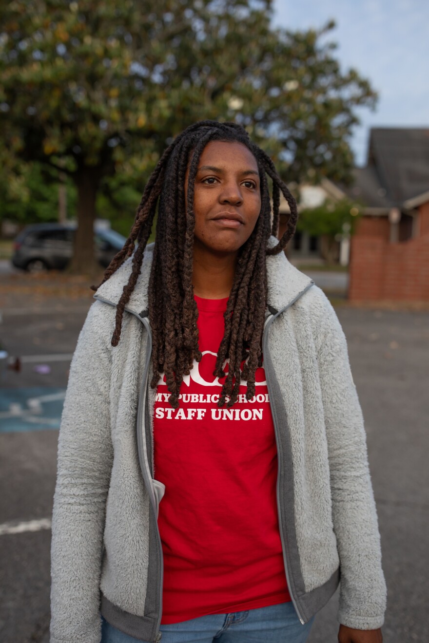 New Hanover County Schools teacher Ebony Savage prepares to board a bus to Raleigh for the 'Kids Over Corporations' rally organized by the North Carolina Association of Educators on May 1, 2026. 