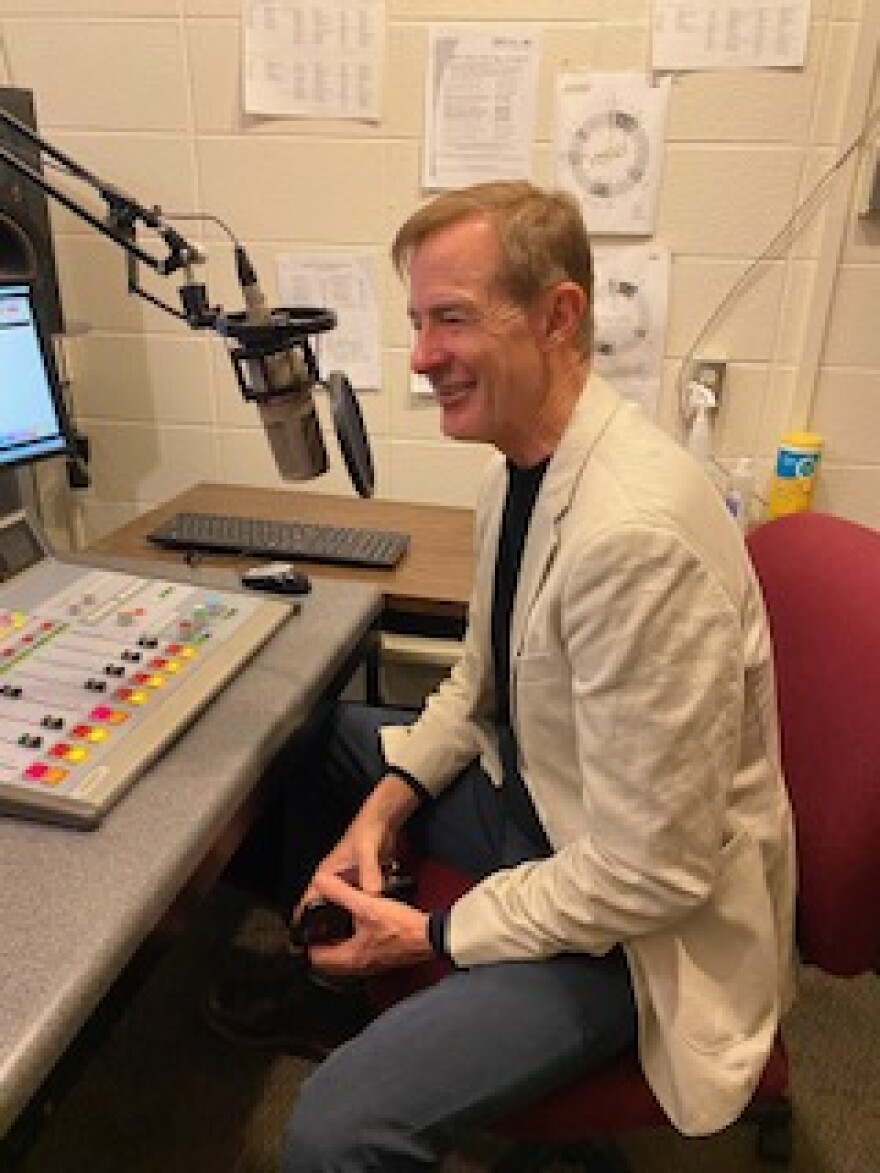 Golden Apple Foundation President Alan Mather speaking into a microphone in the WSIU Studio
