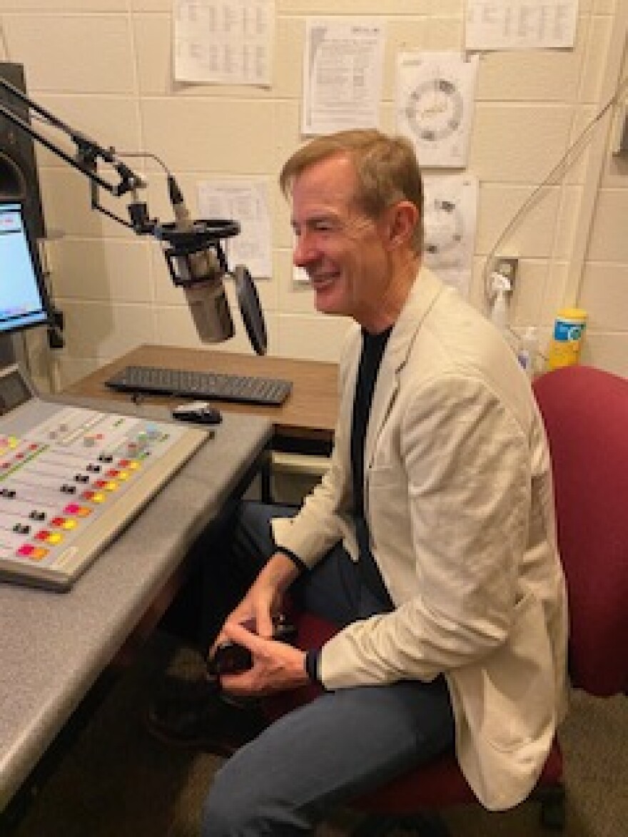 Golden Apple Foundation President Alan Mather speaking into a microphone in the WSIU Studio