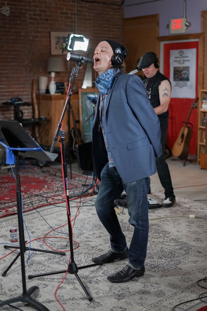 Paul "Pip" Everett belts out a song while Terry Linehan plays during a recent performance.