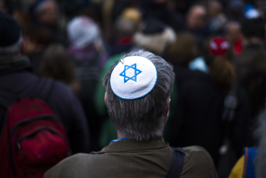 A man wears a Jewish skullcap, as he attends a demonstration against an anti-Semitic attack in 2018.