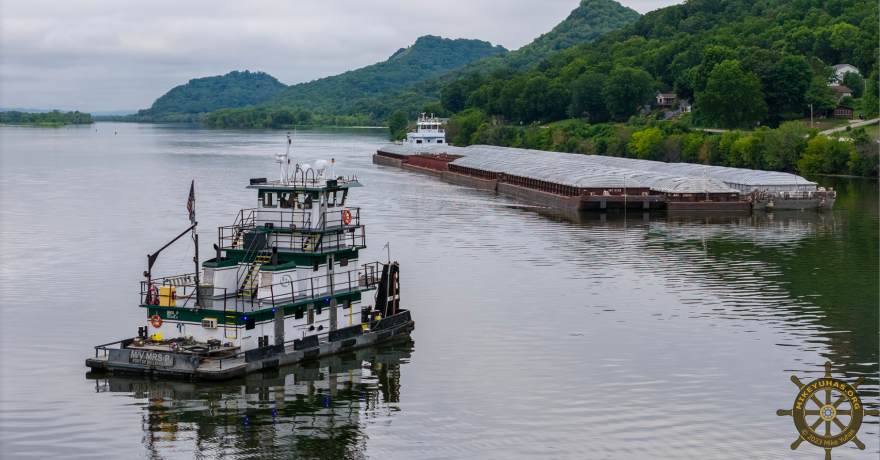 Mike Napper's tug and pull boat, "Mrs. P," prepares to assist a barge on the Mississippi River on Saturday, July 29, 2023