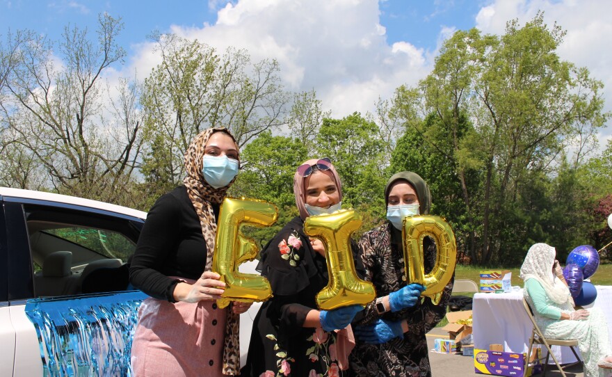 Hala Katato, Reem Kashian, and Safa Kassab, 26, pose with the mosque’s foil decorations. 