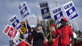 United Auto Workers members walk the picket line at the Ford Michigan Assembly Plant in Wayne, Michigan. (Paul Sancya/AP)