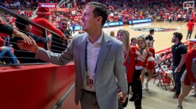 UNM Athletic Director Fernando Lovo greets fans as he leaves the Pit after he and his family were introduced during a Dec. 4, 2024 game against San Jose State. Eddie Moore