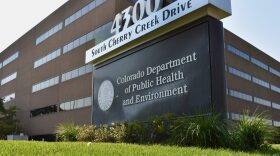 The outside of a larger brick building that stands five stories.