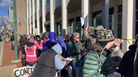 Protestors gather outside of the Washington County Commissioners office.