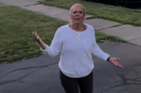 Screenshot of Susan Rice shouting at a family before going on their porch and punching a 16-year-old boy.