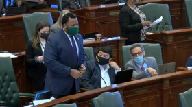 Rep. Kam Buckner, D-Chicago, speaks in favor of a bill allowing college athletes to collect endorsements for the use of their name or likeness.