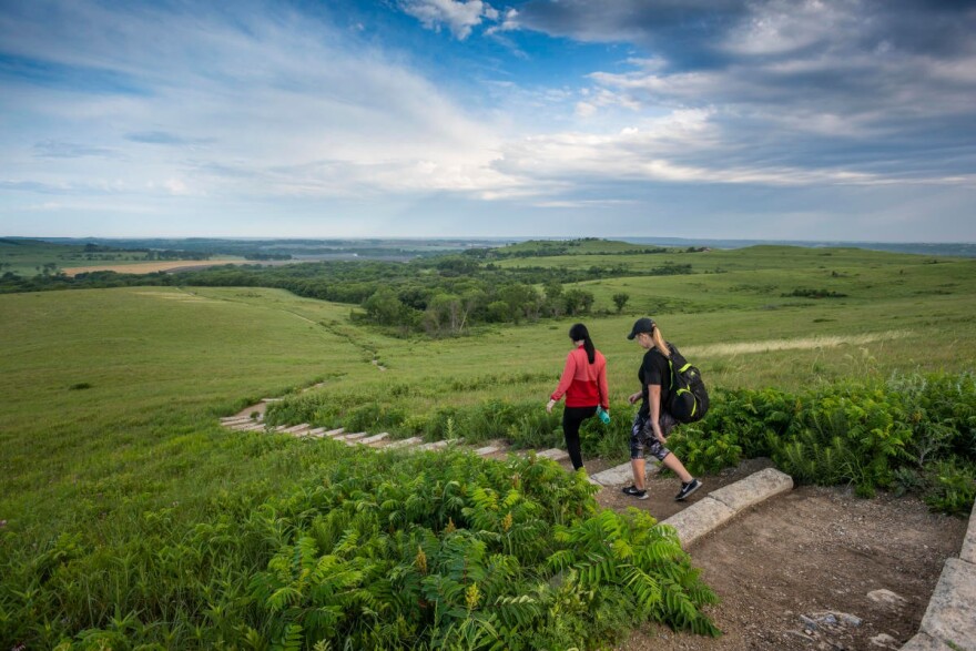 Hikers experience the Flint Hills on the Konza Prairie Nature Trail.
