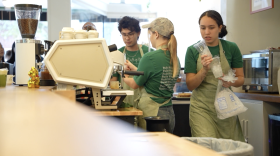 Workers scramble to fill orders at Brewing Thoughts, Gainesville's newest coffee shop.
