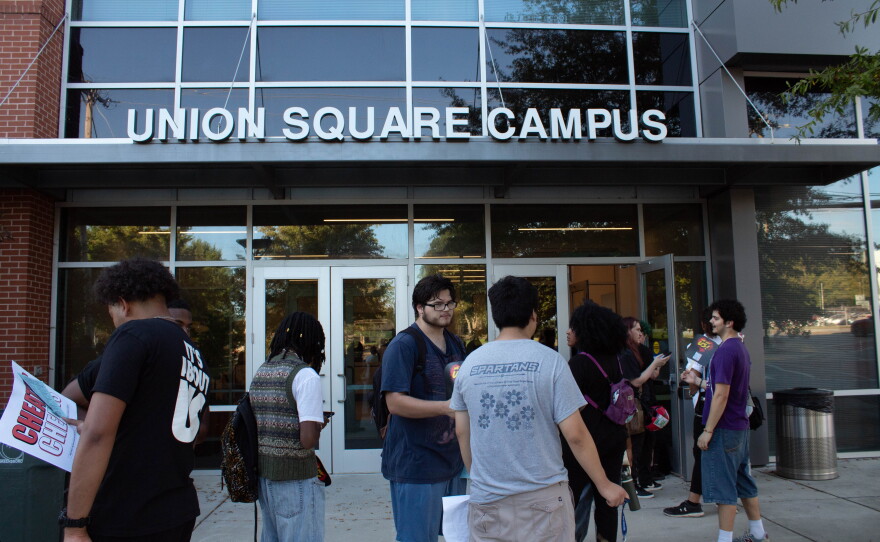Students march an early voting polling site at Union Square.