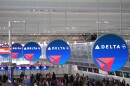 Delta Air Lines signs hang at Minneapolis-St. Paul Airport Monday, March 16, 2026, in Minneapolis. (AP Photo/Abbie Parr)