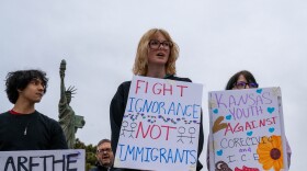 Darley Kasper, right, was one of dozens of protesters outside of city hall in Leavenworth, Kansas, who demonstrated against CoreCivic and the Trump administration's immigration policies.