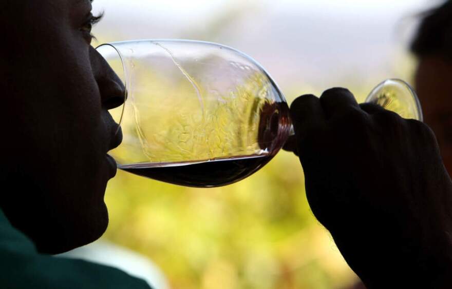 A guest samples a glass of wine during a tasting. (Justin Sullivan/Getty Images)