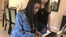 Andrea PeÃ±a plays the piano at her Parkland home as her friend, Sawyer Garrity, sings. The two Marjory Stoneman Douglas High School students wrote a song called "Shine" after the Feb. 14 shooting.