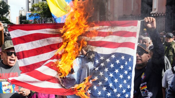 Government supporters burn a U.S. flag in Caracas, Venezuela, Saturday, Jan. 3, 2026, after U.S. President Donald Trump announced that U.S. forces had captured Venezuelan President Nicolás Maduro and his wife.