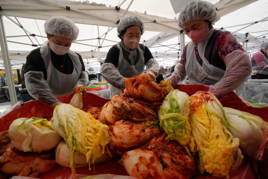 Buddhists make kimchi, a traditional pungent vegetable dish, to donate to needy neighbors, at Jogye temple in Seoul, South Korea, Sunday, Nov. 16, 2025.