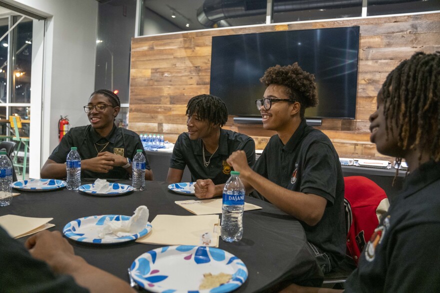Milwaukee Public Schools students attend a community conversation with Milwaukee Bucks basketball player Cameron Payne at the American Black Holocaust Museum in Milwaukee. The conversation was part of a mentoring program through the school district’s Department of Black and Latino Male Achievement.