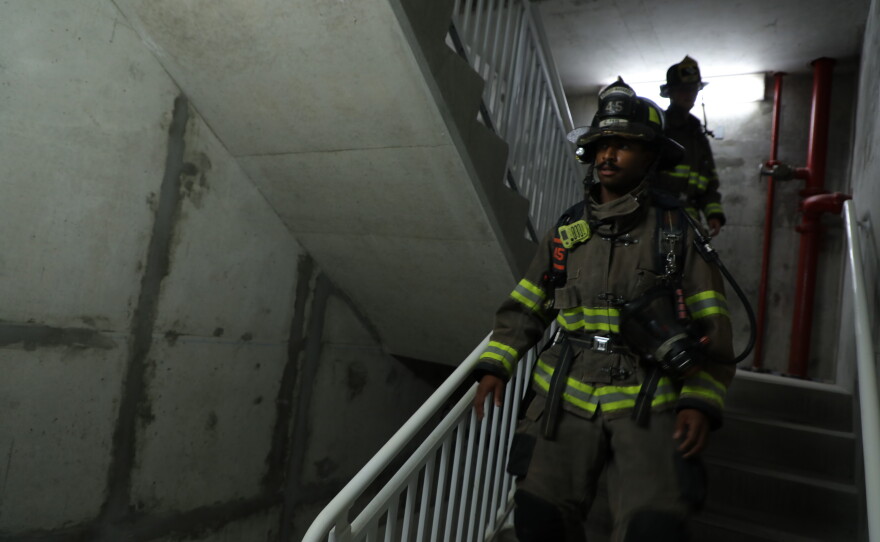 Firefighters participate in the 9-11 stair climb on Navarre Beach.