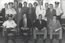 Sgt. Perry White, left, stands among NOPD officers receiving reward checks in 1971. White is pictured in the second row, second from left.