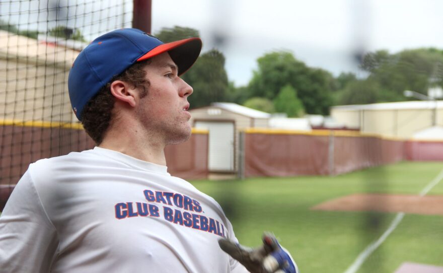 WATCHING IT FLY -- Patrick Pinak watches a ball he hit during Friday's home run derby hosted by the University of Florida's club baseball team at Oak Hall School in Gainesville, Fla. Pinak, the team's clean-up hitter, hit one home run in the final round to finish in second place. (photo by Taylor Gaines)