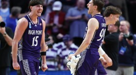 High Point forward Braden Hausen (15) celebrates with guard Chase Johnston, right, after the first round of the NCAA college basketball tournament against Wisconsin, Thursday, March 19, 2026, in Portland, Ore.