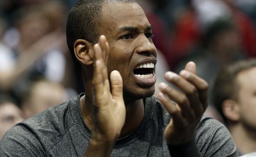 Jason Collins reacts from the bench at an NBA game in Milwaukee on March 1, 2014.